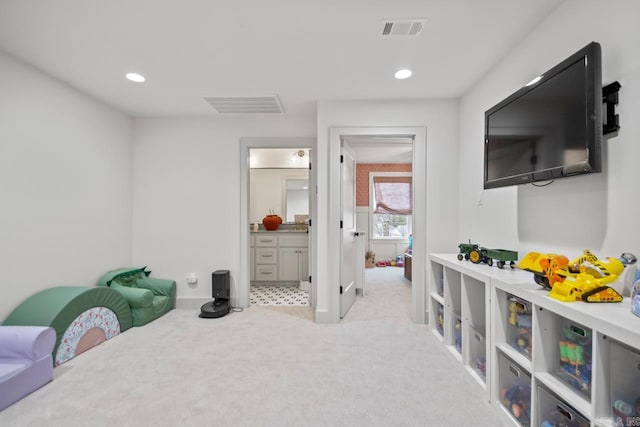 bedroom featuring light carpet