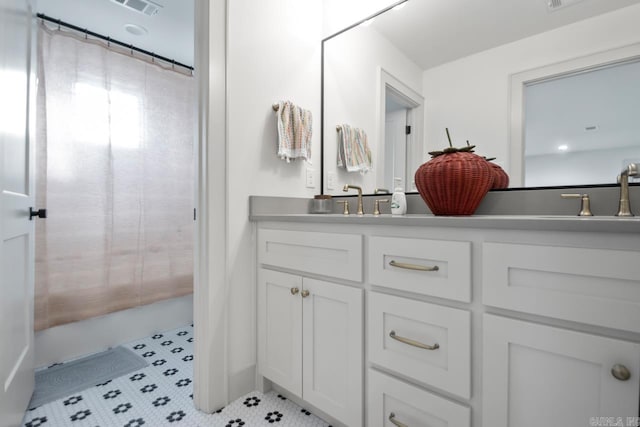 bathroom featuring vanity and tile patterned flooring