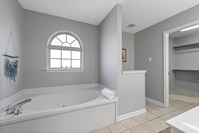 bathroom featuring a bath and tile patterned floors