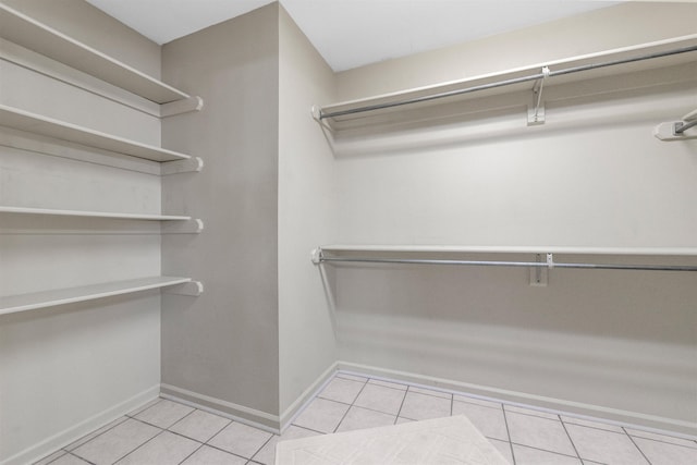 walk in closet featuring light tile patterned floors