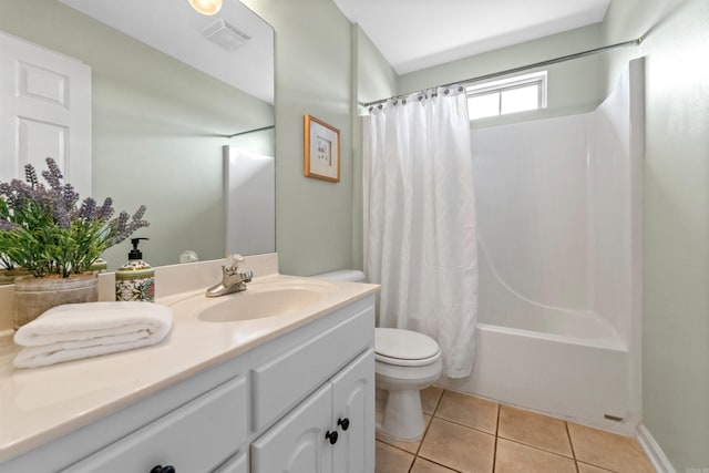 full bathroom featuring shower / bath combination with curtain, vanity, tile patterned floors, and toilet