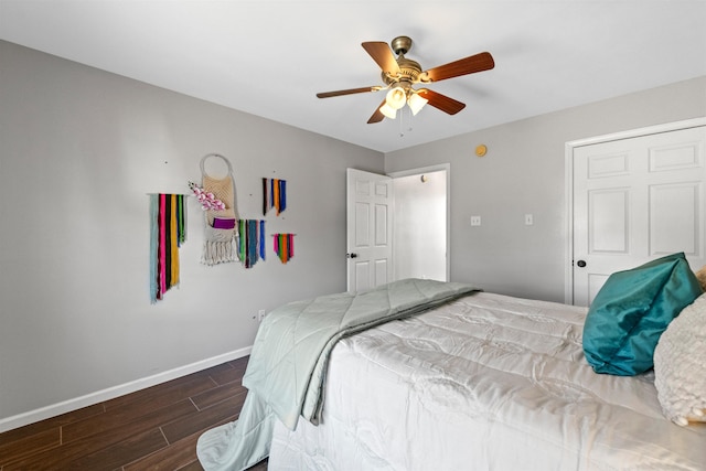 bedroom with ceiling fan and dark hardwood / wood-style flooring