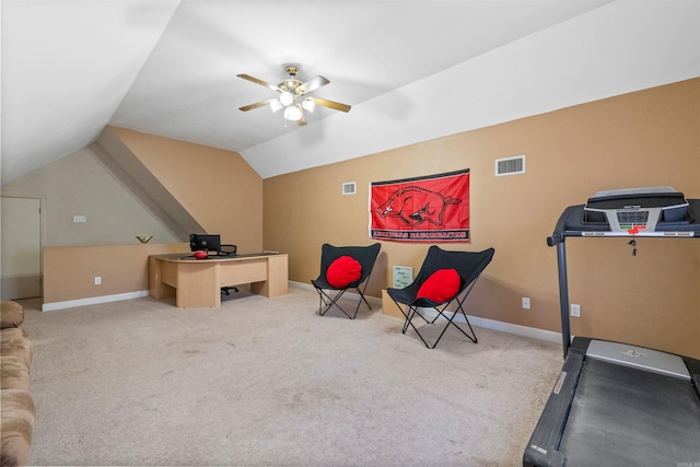 workout room with vaulted ceiling, light colored carpet, and ceiling fan