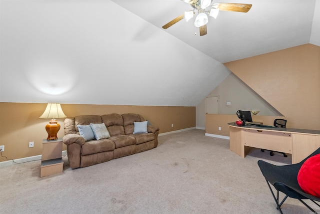 interior space with vaulted ceiling, light colored carpet, and ceiling fan