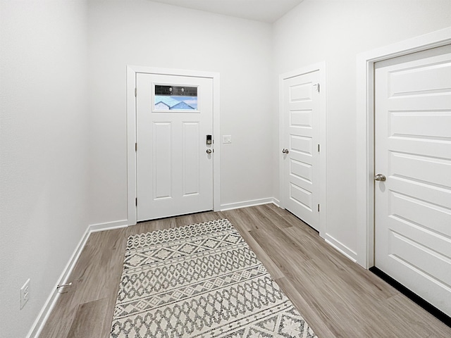 foyer entrance with light wood-type flooring