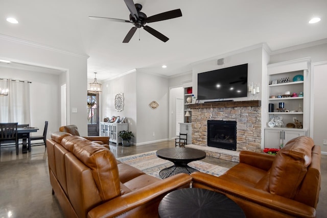 living room with ornamental molding, a stone fireplace, ceiling fan with notable chandelier, and built in features