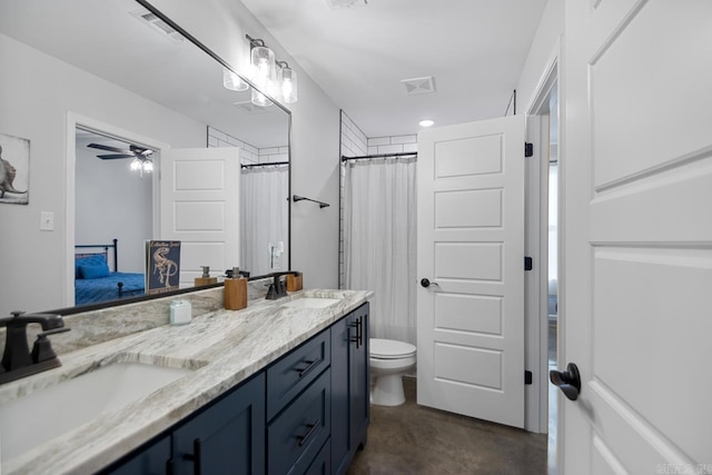 bathroom featuring vanity, toilet, curtained shower, and concrete floors