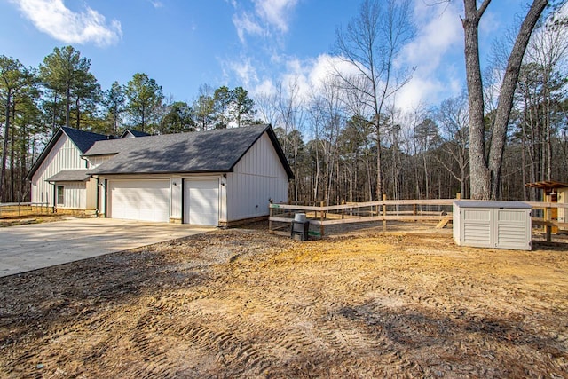 view of side of property with a garage