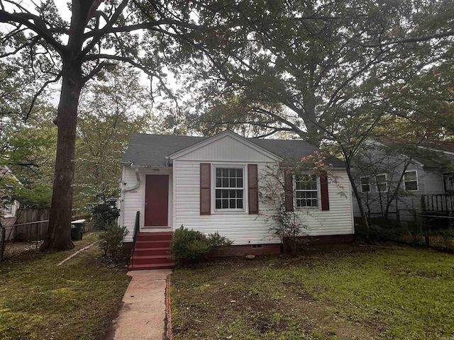 bungalow with a front lawn