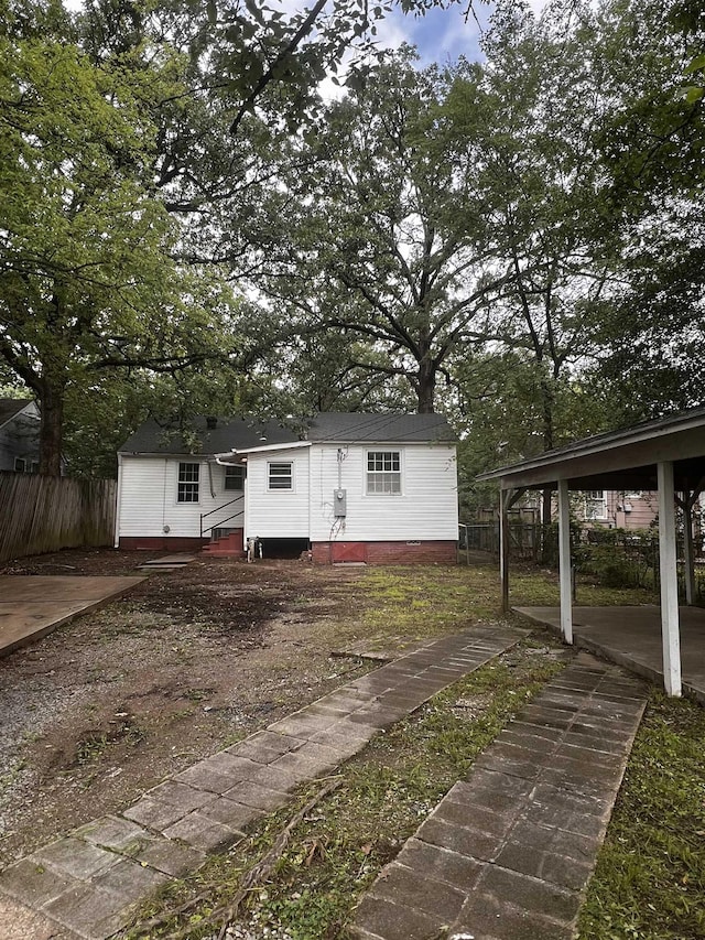 exterior space featuring a carport