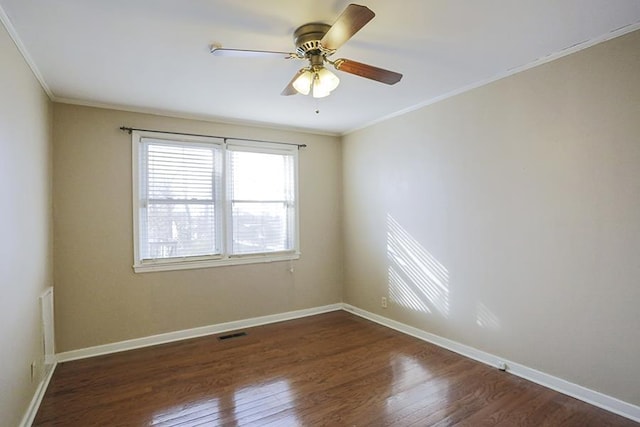 unfurnished room featuring ceiling fan, ornamental molding, and dark hardwood / wood-style floors