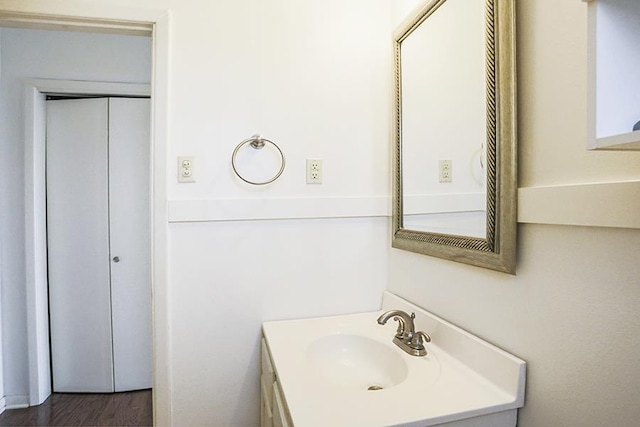 bathroom featuring hardwood / wood-style flooring and vanity