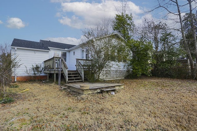 back of property featuring a deck