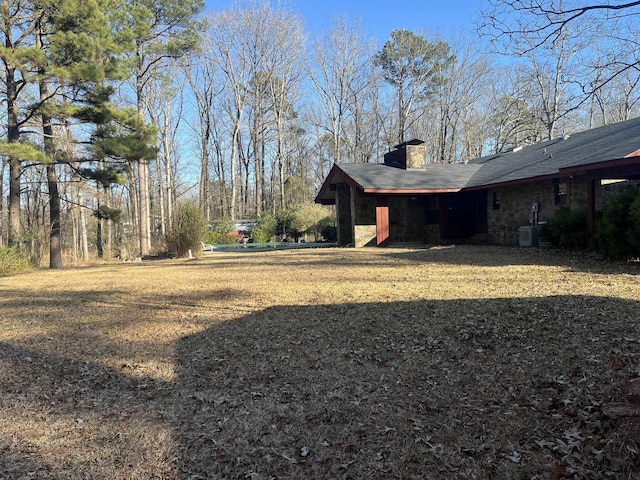 view of yard with central AC