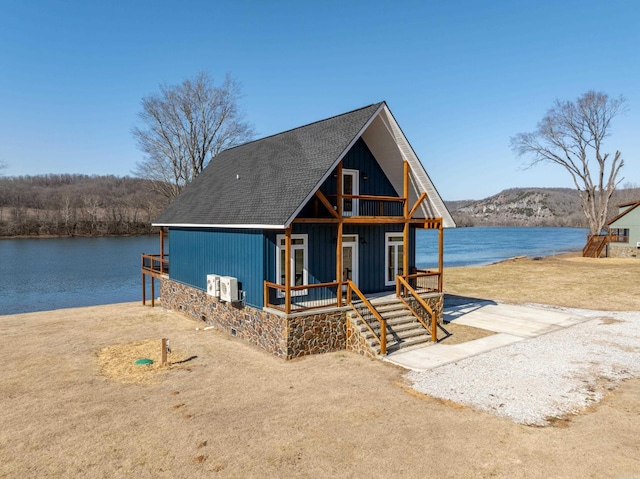 view of front facade with a water view