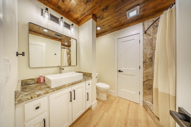 bathroom with toilet, wooden ceiling, vanity, a shower with shower curtain, and hardwood / wood-style floors