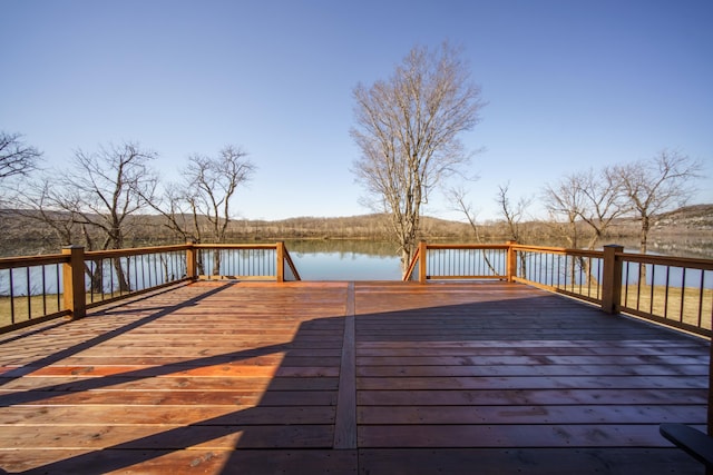 wooden deck with a water view