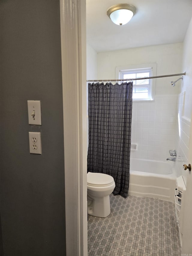 bathroom featuring shower / tub combo with curtain, toilet, and tile patterned flooring