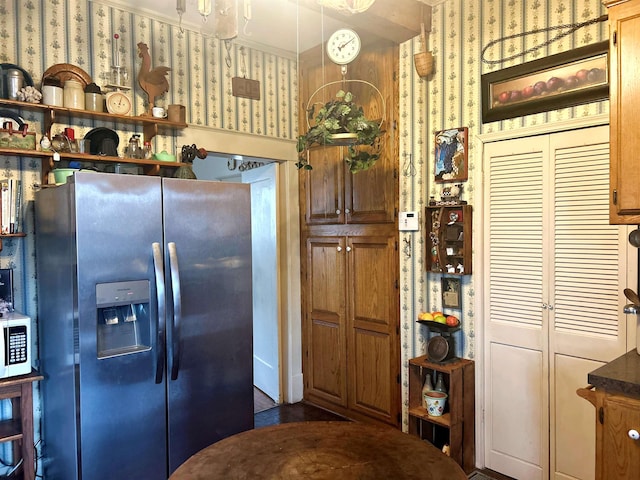 kitchen with stainless steel fridge with ice dispenser