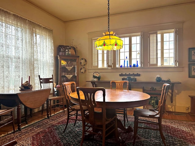 dining area featuring wood-type flooring