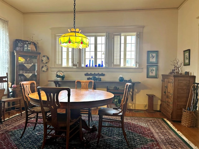 dining area with wood-type flooring