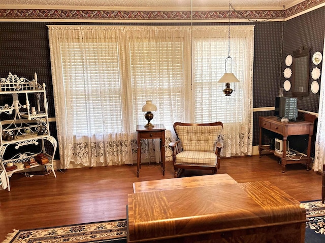 living area with hardwood / wood-style floors and a wealth of natural light