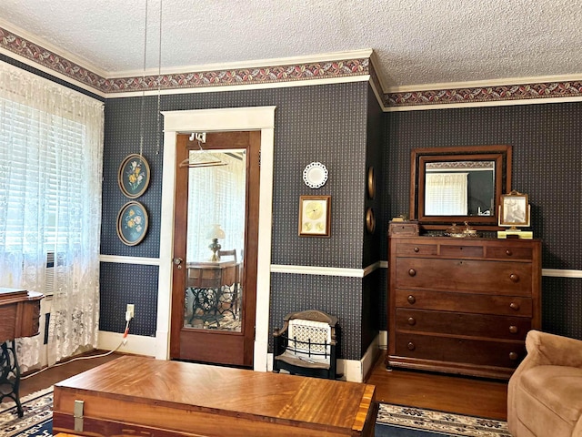 office area with crown molding, hardwood / wood-style floors, and a textured ceiling