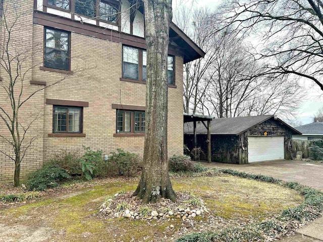 view of side of property with an outbuilding and a garage