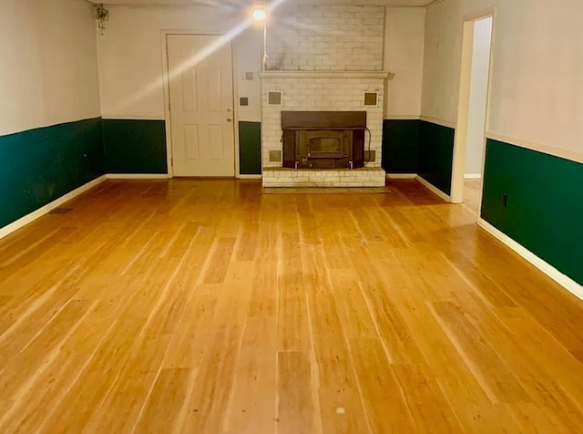 unfurnished living room featuring hardwood / wood-style floors