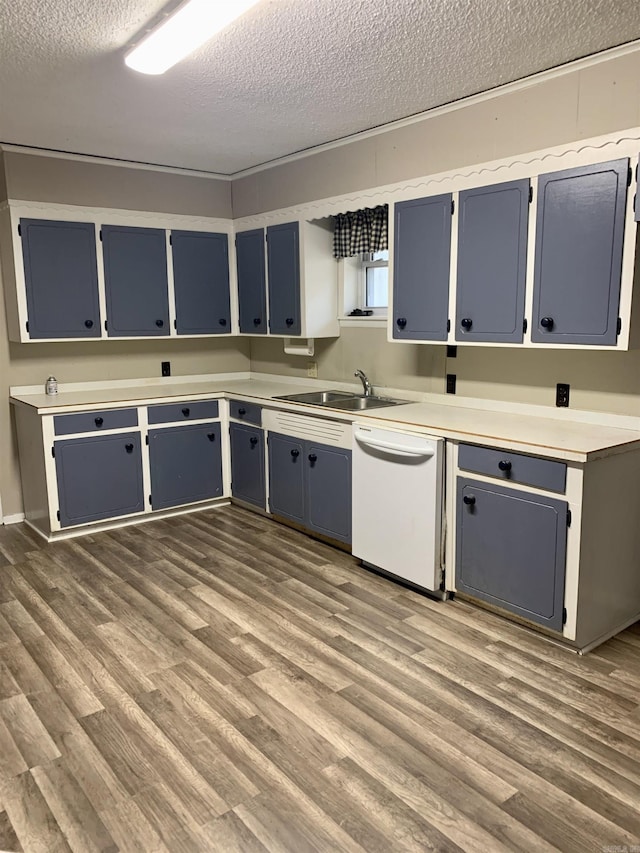 kitchen with dark wood-style floors, a sink, blue cabinetry, and white dishwasher