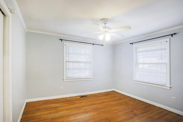 unfurnished room featuring crown molding, hardwood / wood-style floors, and ceiling fan