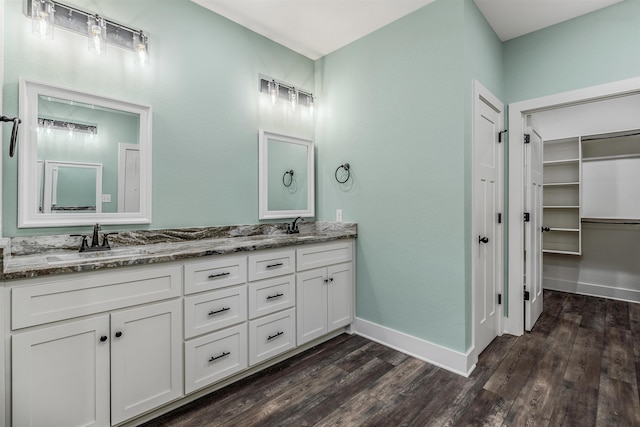 bathroom featuring vanity and hardwood / wood-style floors