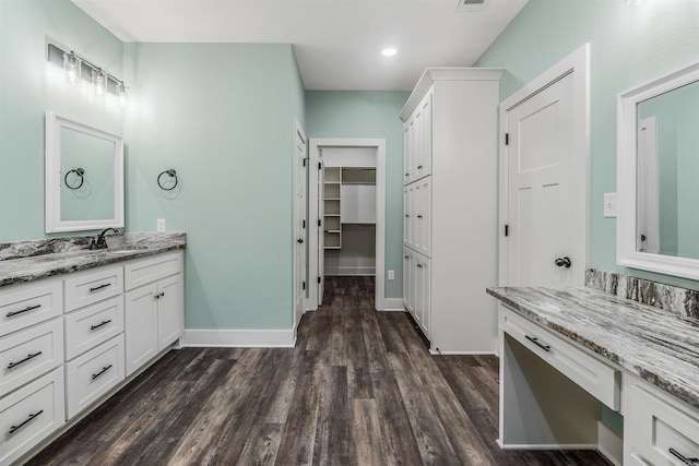 bathroom with wood-type flooring and vanity