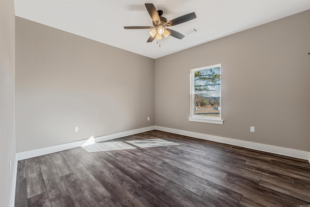 empty room featuring dark hardwood / wood-style floors and ceiling fan