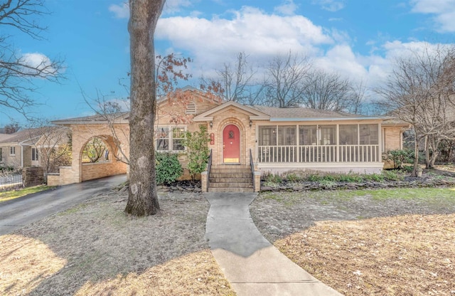 view of front of home with a sunroom