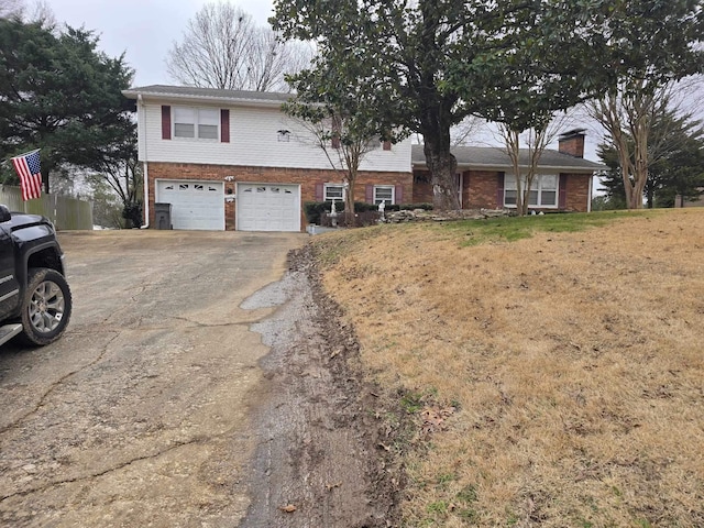 view of front of home featuring a garage and a front yard