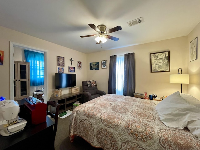 carpeted bedroom with ceiling fan