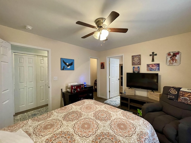 bedroom with ceiling fan and a closet