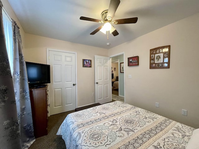 bedroom featuring ceiling fan and dark colored carpet