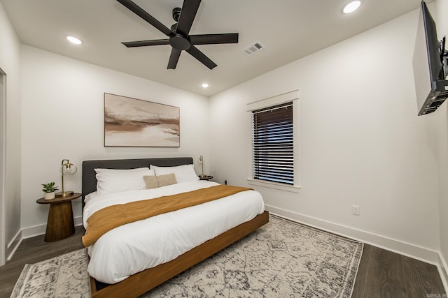 bedroom with ceiling fan and hardwood / wood-style floors