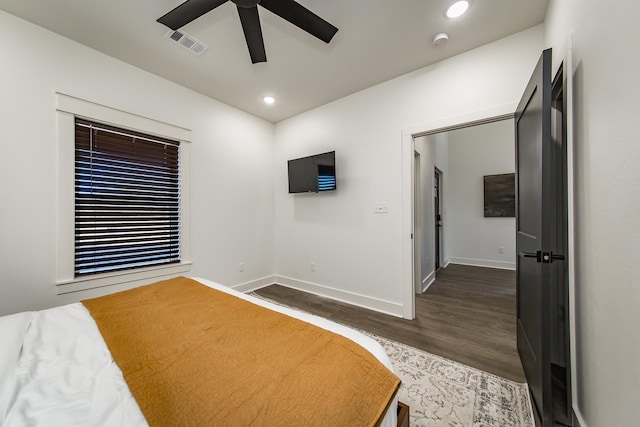 bedroom featuring ceiling fan and dark hardwood / wood-style flooring