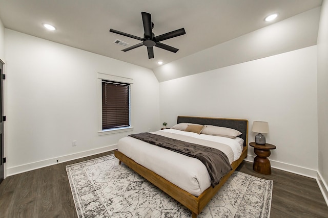 bedroom featuring lofted ceiling, dark wood-type flooring, and ceiling fan