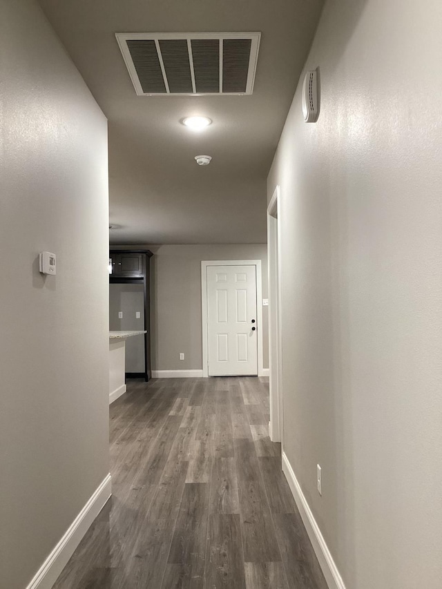 hallway featuring dark hardwood / wood-style floors