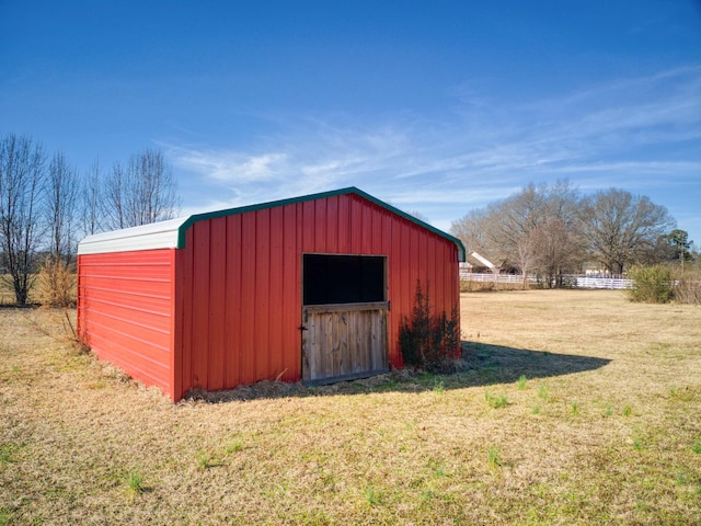 view of outdoor structure with a yard