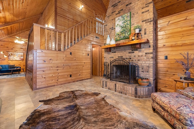 living room with a brick fireplace, wooden walls, and wooden ceiling