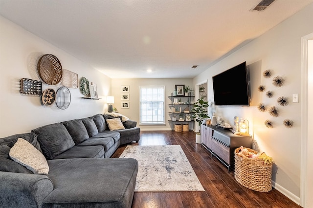 living room with dark hardwood / wood-style floors