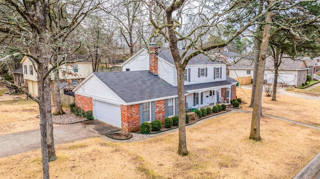 front facade with a garage and a porch