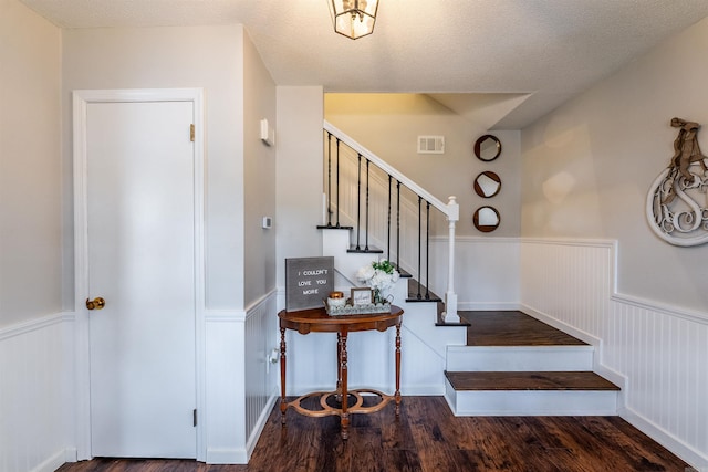 interior space with hardwood / wood-style floors and a textured ceiling