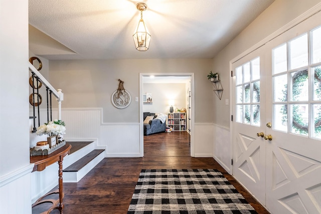 entryway with dark wood-type flooring