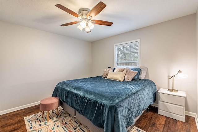 bedroom featuring dark hardwood / wood-style floors and ceiling fan